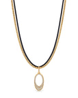 A double-strand necklace featuring a gold chain and a black cord, with a gold oval pendant adorned with small clear stones, shown against a plain white background.